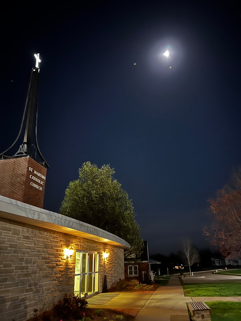 The stars and moon shine over St. Martin Church in St. Martins during the Seven Churches Pilgrimage the night of Holy Thursday.